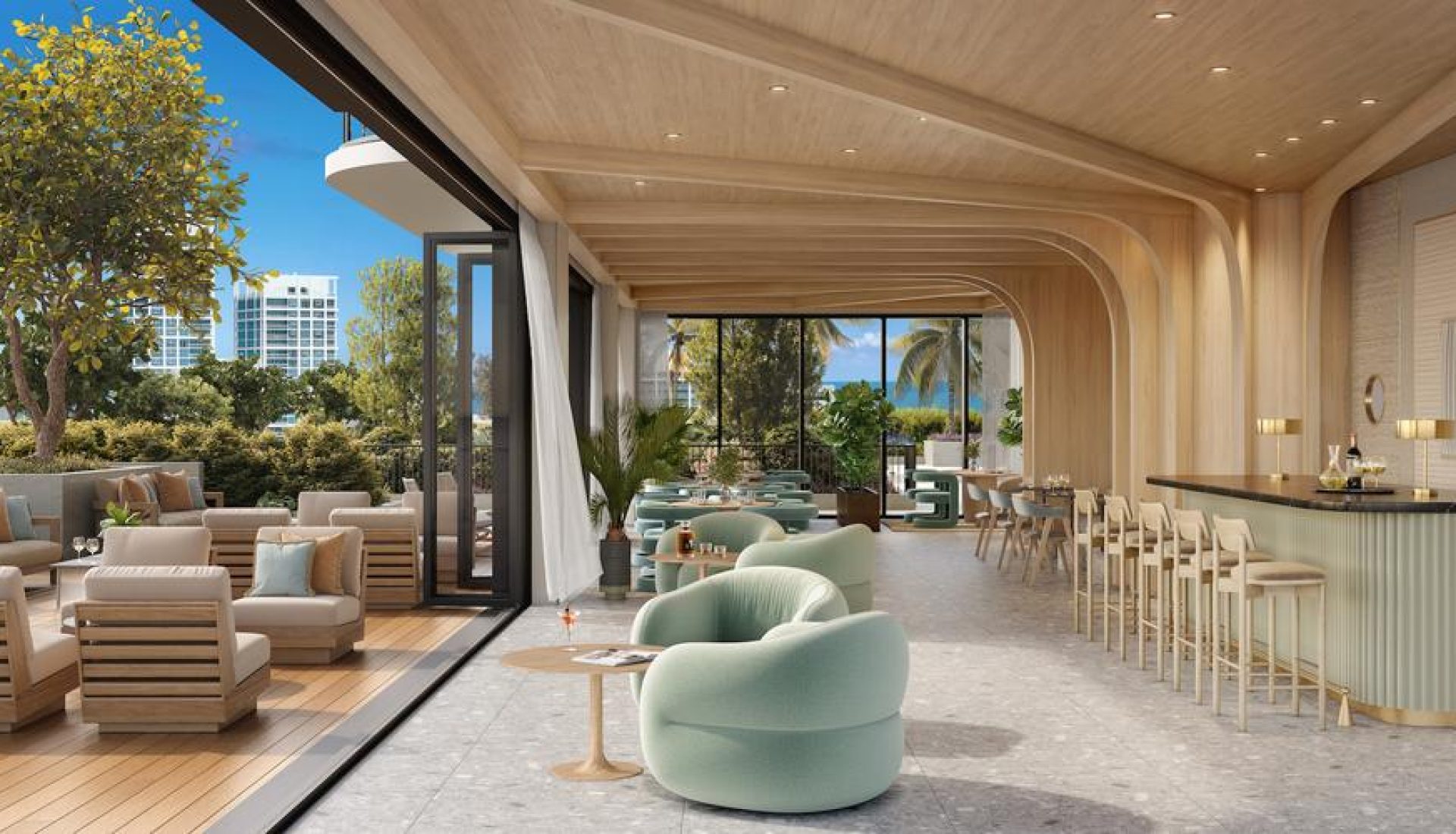 Open-air lounge and bar with light wood interior, mint-green chairs, beige sofas, and a sea-view terrace with palm trees and modern decor.