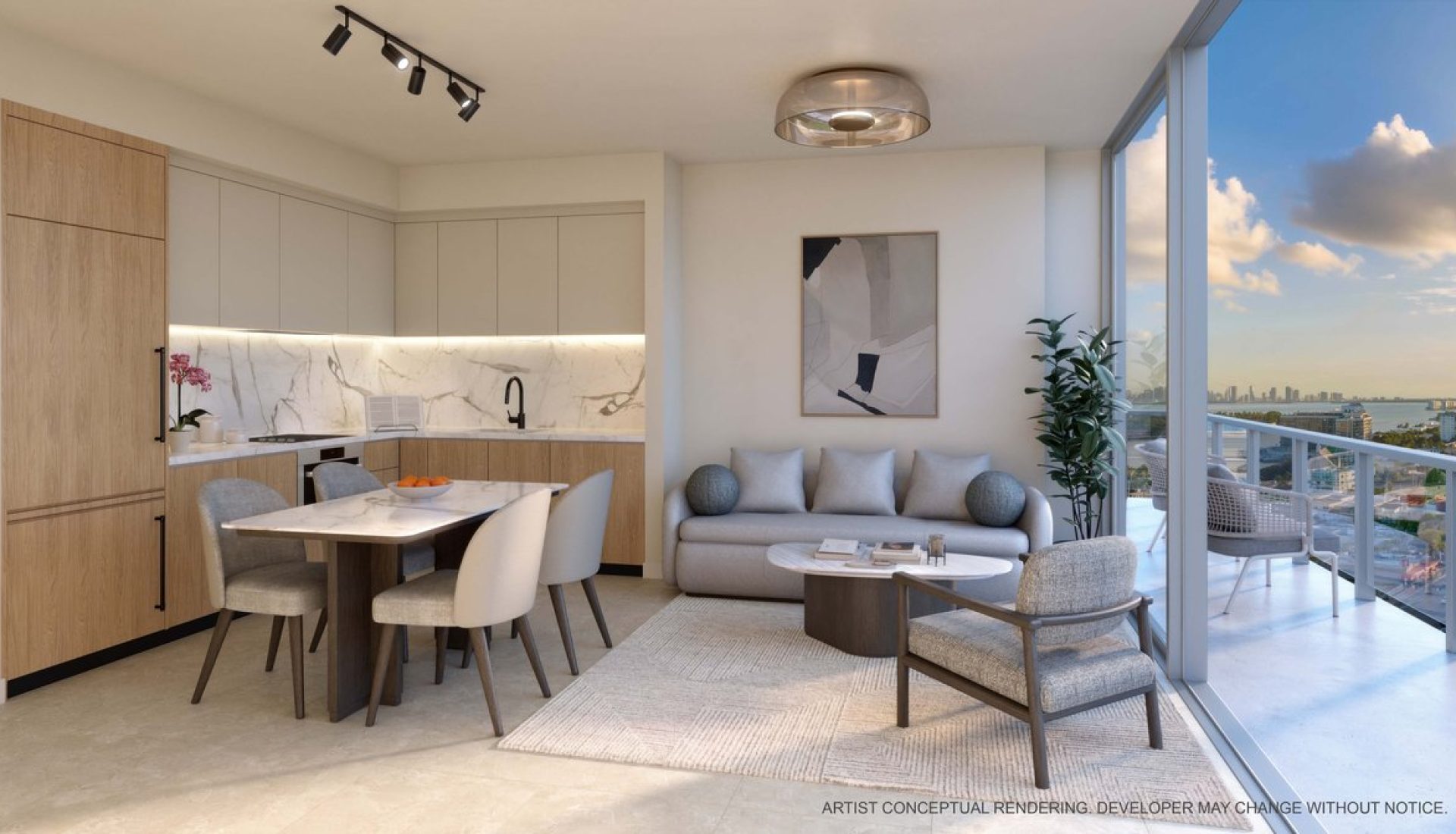 Open-concept living area with a marble backsplash, wooden cabinets, dining table, and a gray sofa, overlooking a city skyline from a glass balcony door.