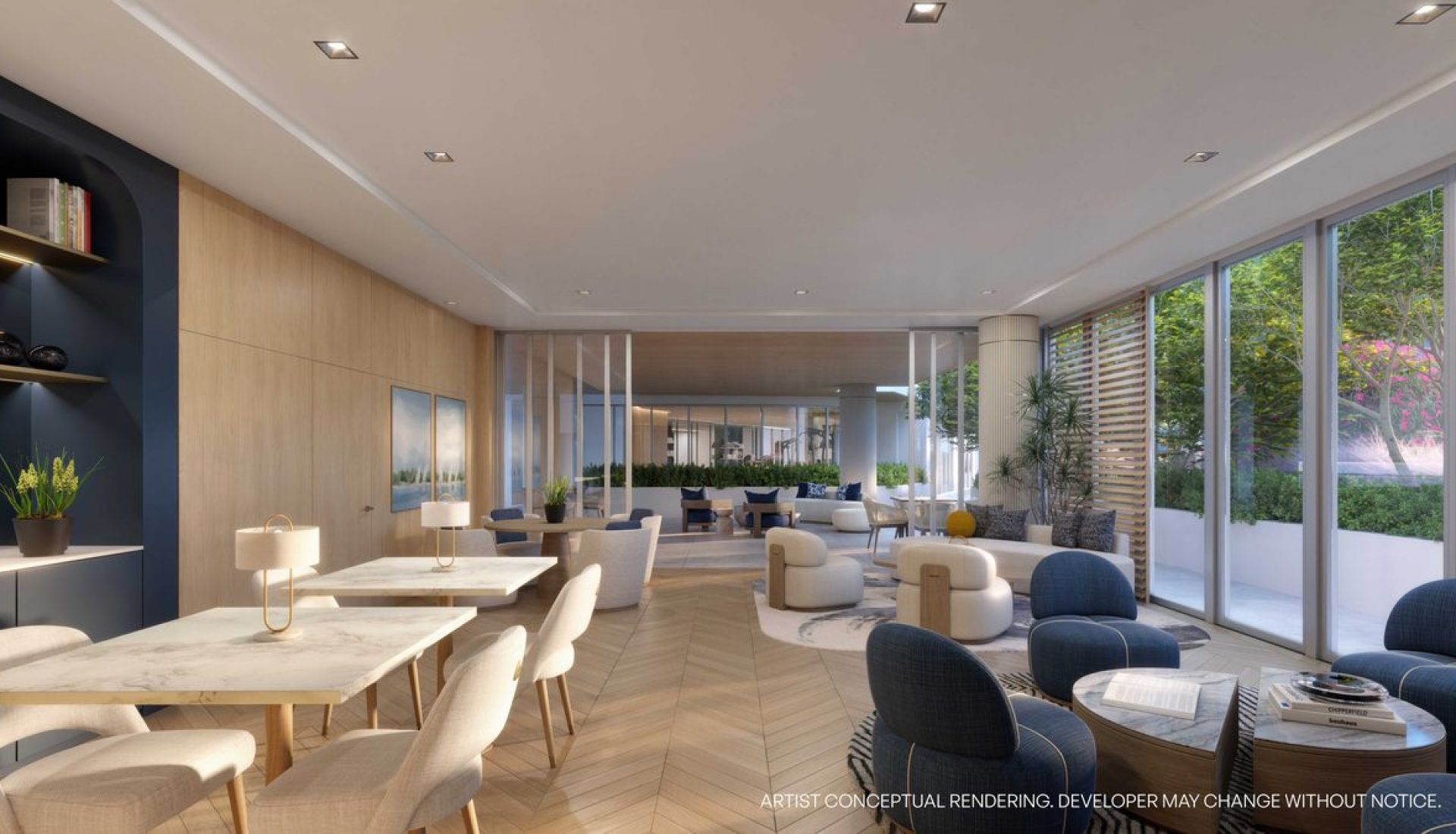 Bright, modern hotel lobby lounge with marble-topped tables, beige chairs, and blue armchairs by large floor-to-ceiling windows
