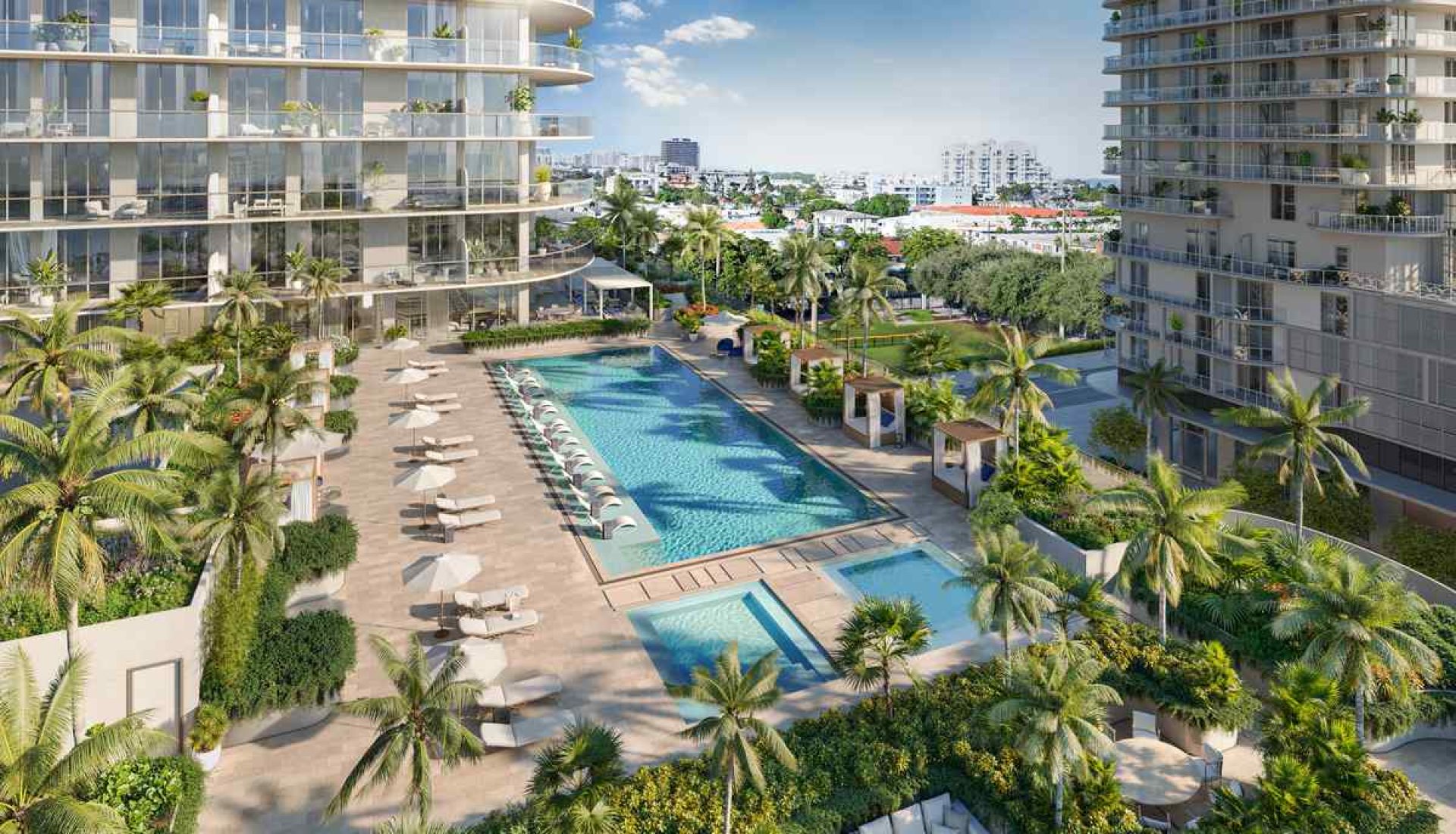 Luxury apartment complex with a central swimming pool, loungers, and palm trees between glass-fronted buildings.