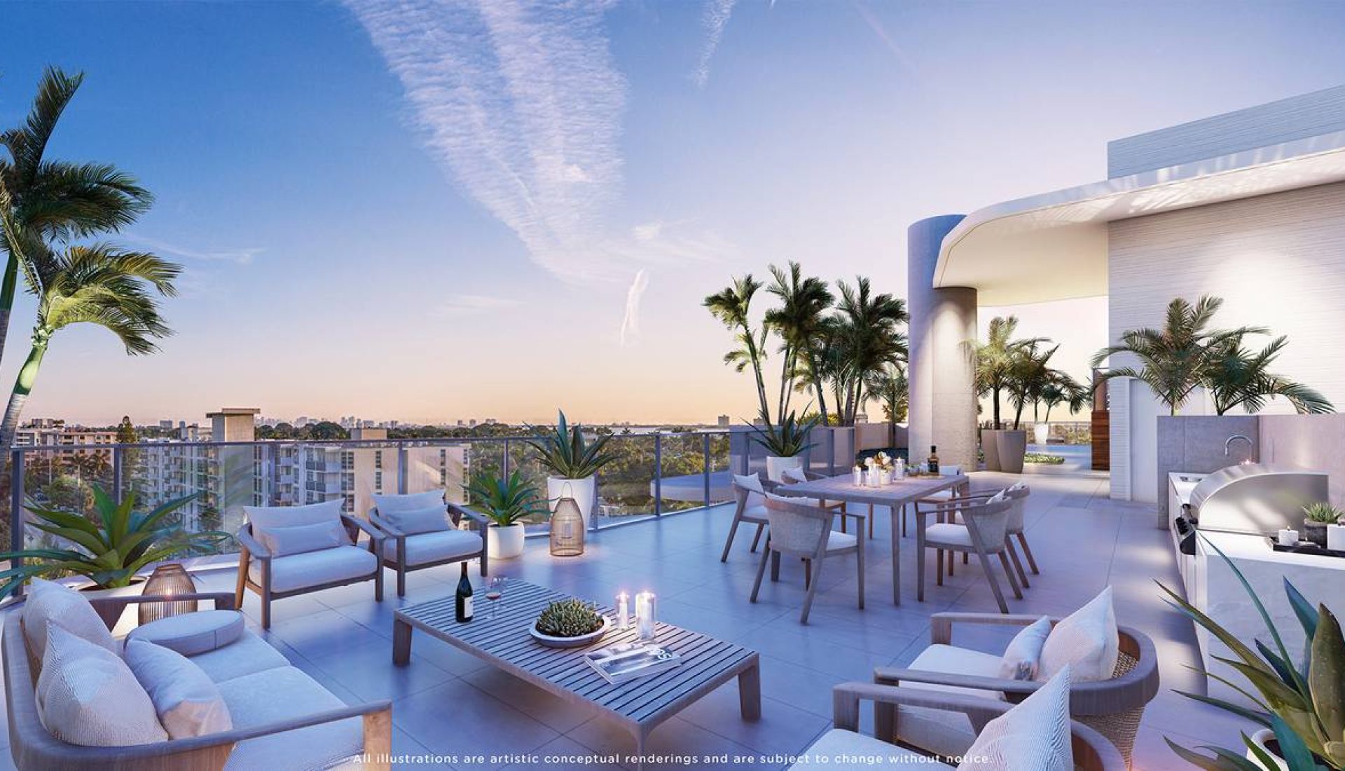 Modern rooftop terrace at sunset with lounge seating, a dining table, and potted palm plants overlooking a city skyline.