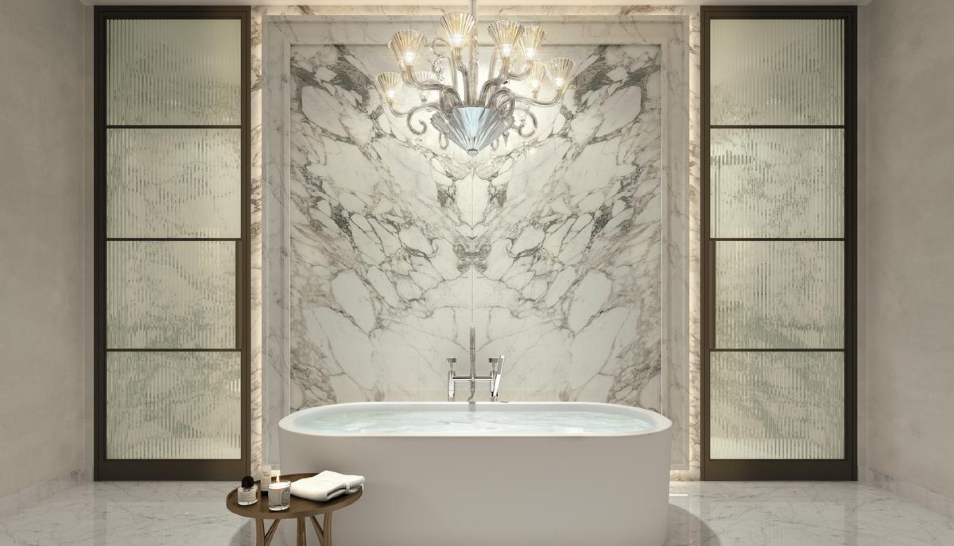 Luxurious marble bathroom with a freestanding oval tub, crystal chandelier, and frosted glass doors on each side.