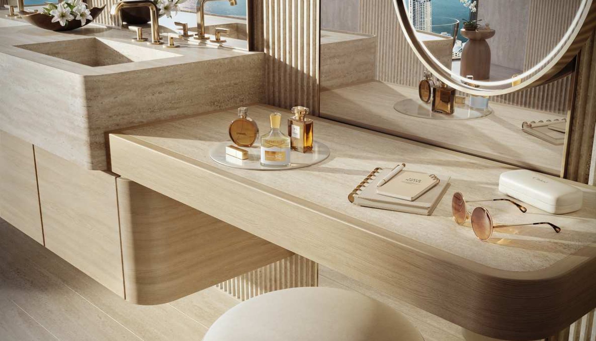 Luxurious vanity with round illuminated mirror, beige marble desk, and perfume bottles by a cityscape window