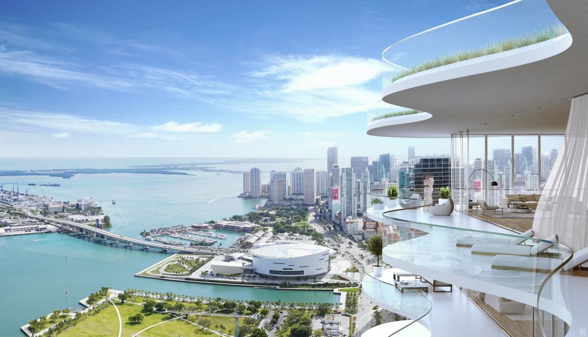 Luxurious curved-glass balcony overlooking a coastal city, marina, and skyline by the sea.