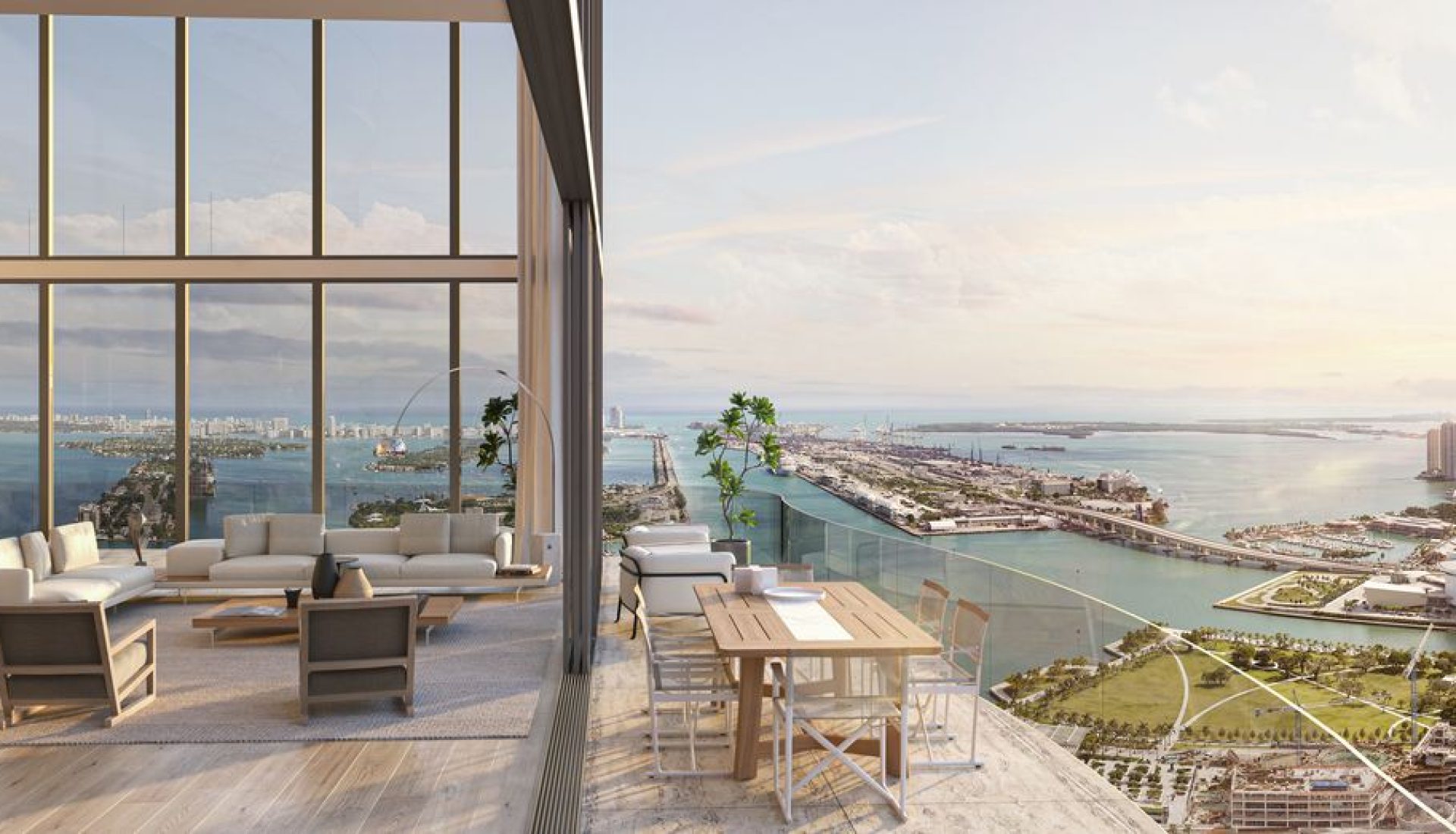 Modern living room with floor-to-ceiling windows overlooking a coastal city and harbor.