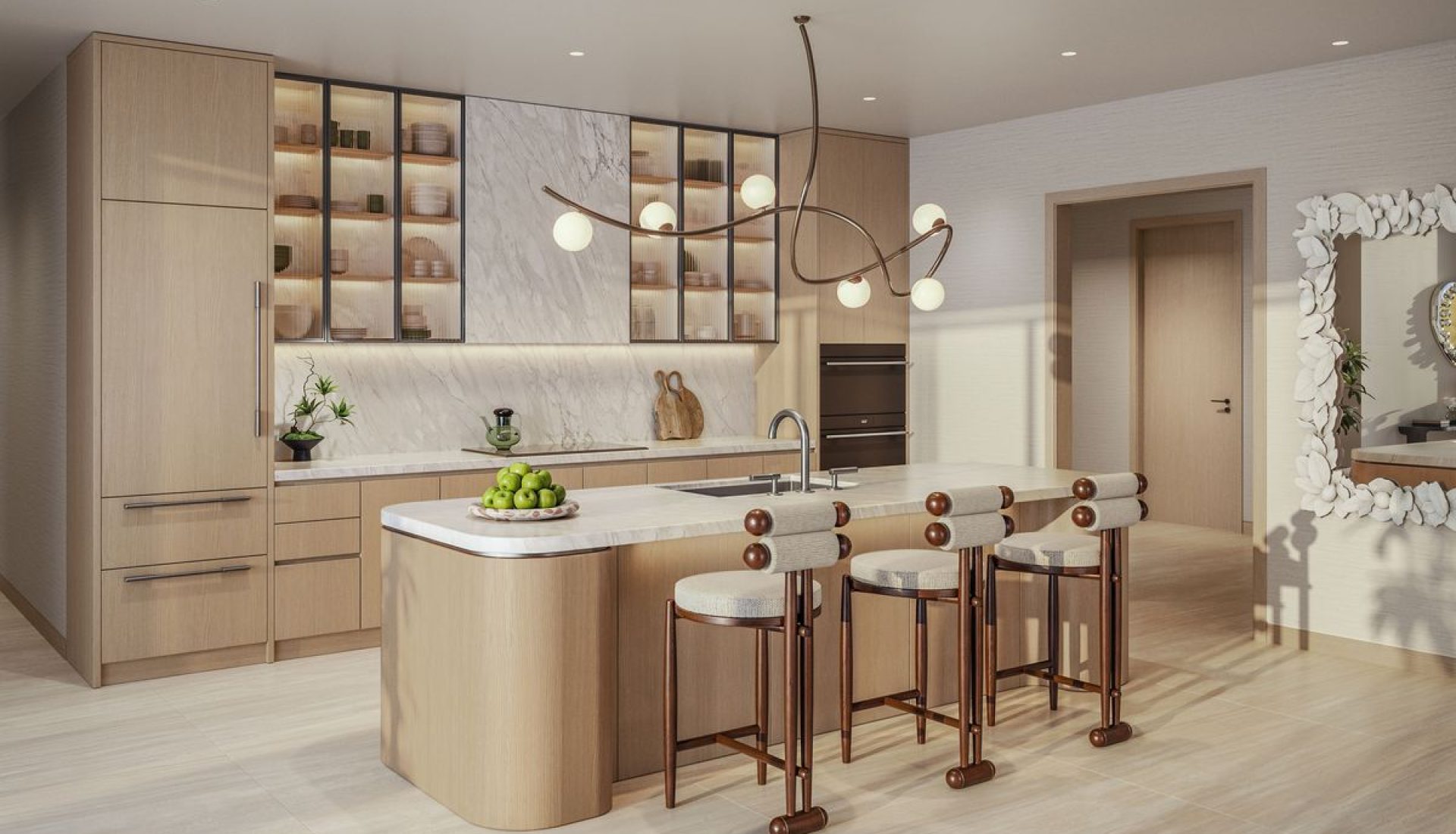 Modern kitchen with a curved island, light wood cabinets, marble backsplash, and a sculptural chandelier above the island.