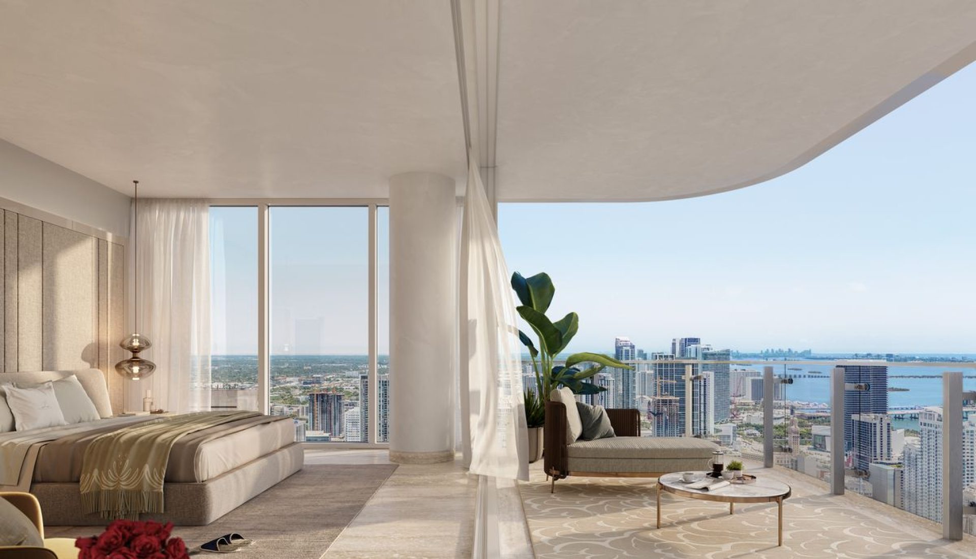 Luxurious hotel bedroom with a plush king bed, sheer curtains, and a spacious balcony with city and water views.