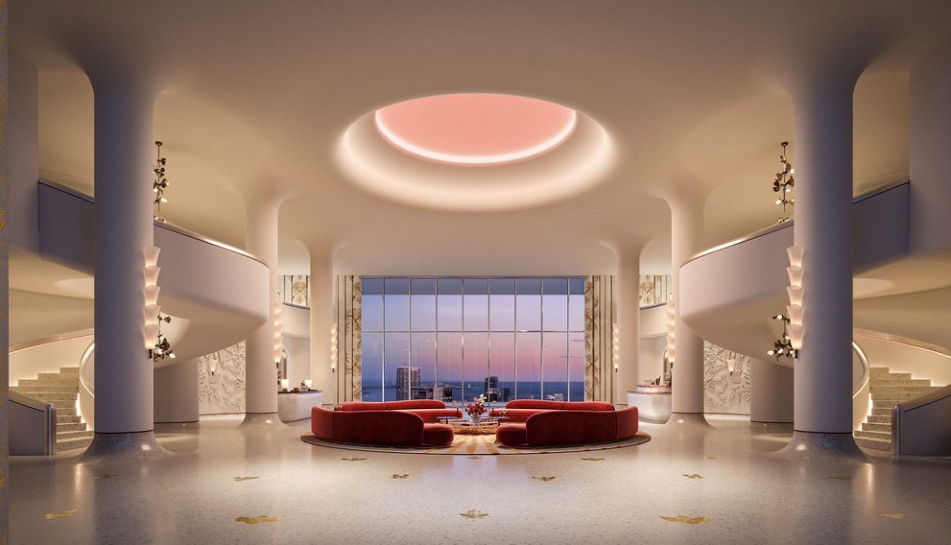 Luxurious hotel lobby with curved staircases, circular pink ceiling light, and red sofa seating facing a city skyline through large windows.