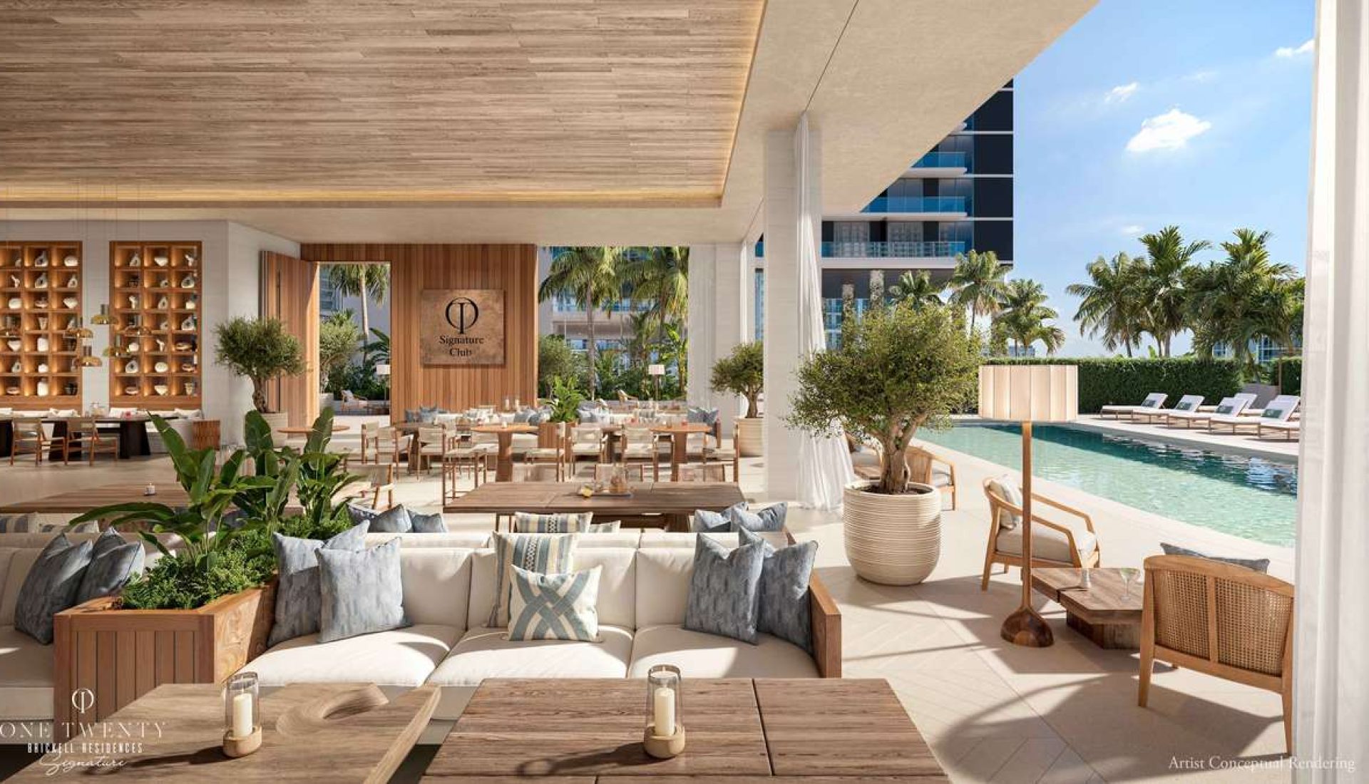 Open-air hotel restaurant and lounge with sofas, wooden tables, and potted plants beside a pool and palm trees.