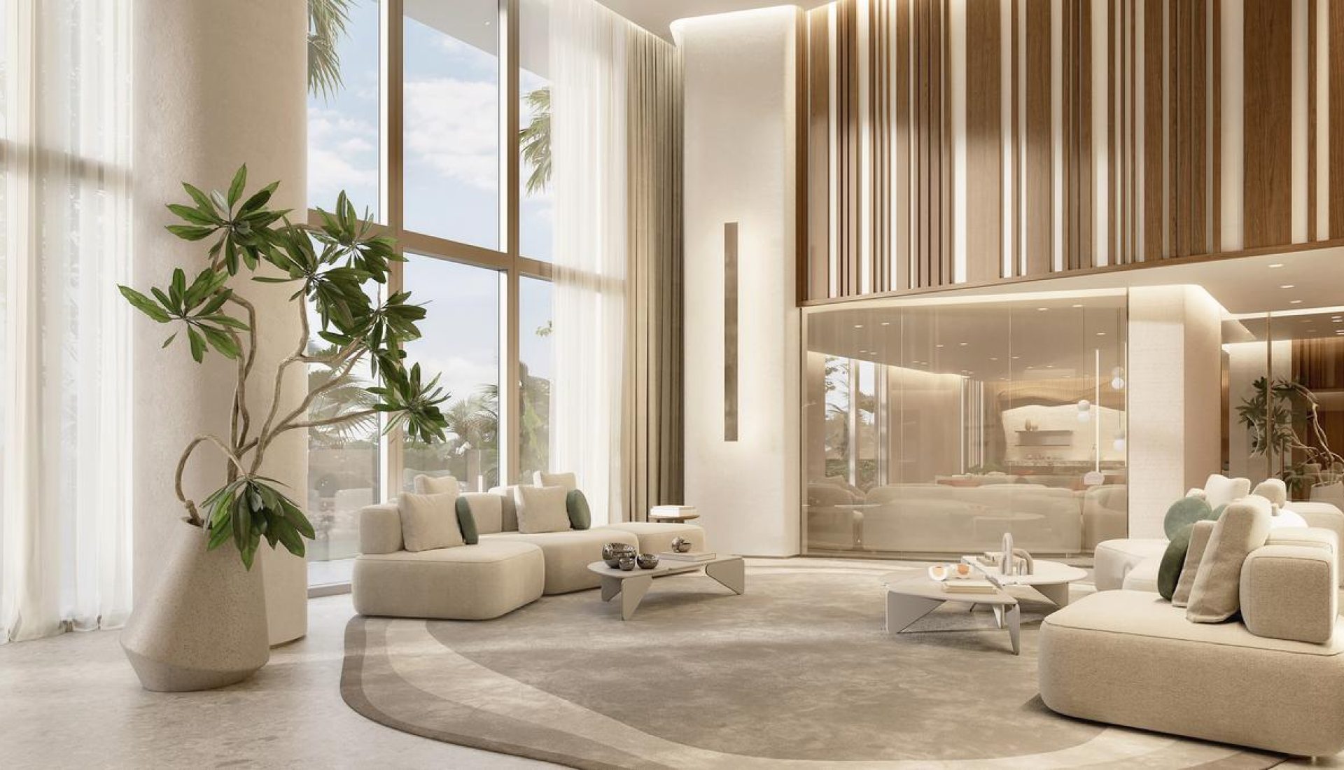 Bright, modern living area with beige sectional sofas, low coffee tables, and large floor-to-ceiling windows letting in natural light.”,