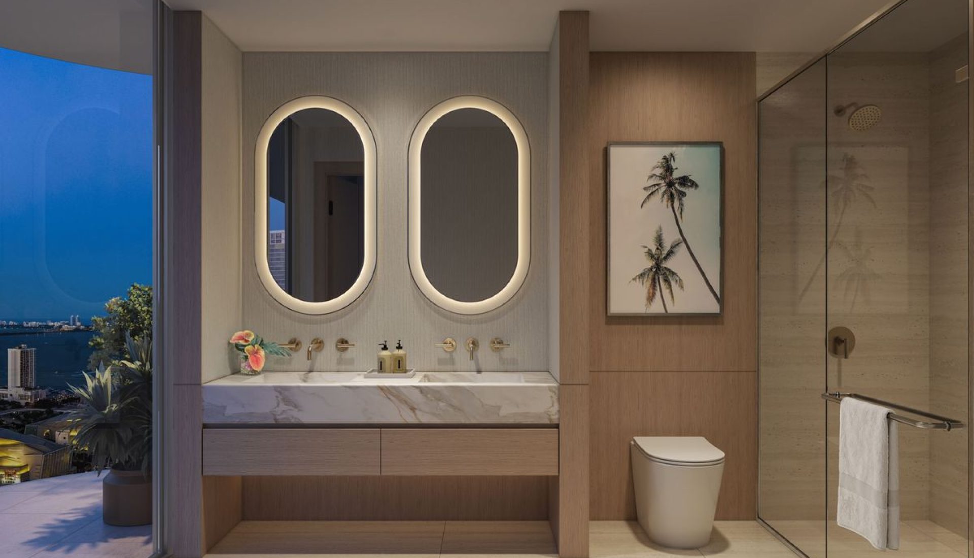 Luxurious bathroom with two illuminated oval mirrors above a marble vanity and gold faucets.