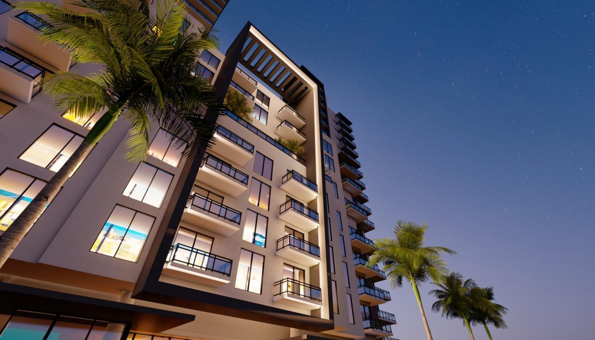 Modern night-time apartment building with lit windows and glass balconies, flanked by palm trees under a starry sky
