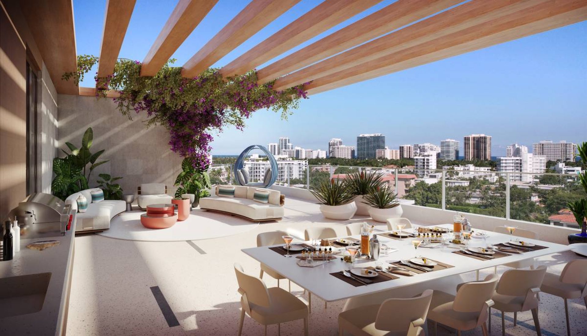 Rooftop terrace with a long dining table set for a meal, beige chairs, lounge seating, and a city skyline beyond a glass railing on a sunny day.