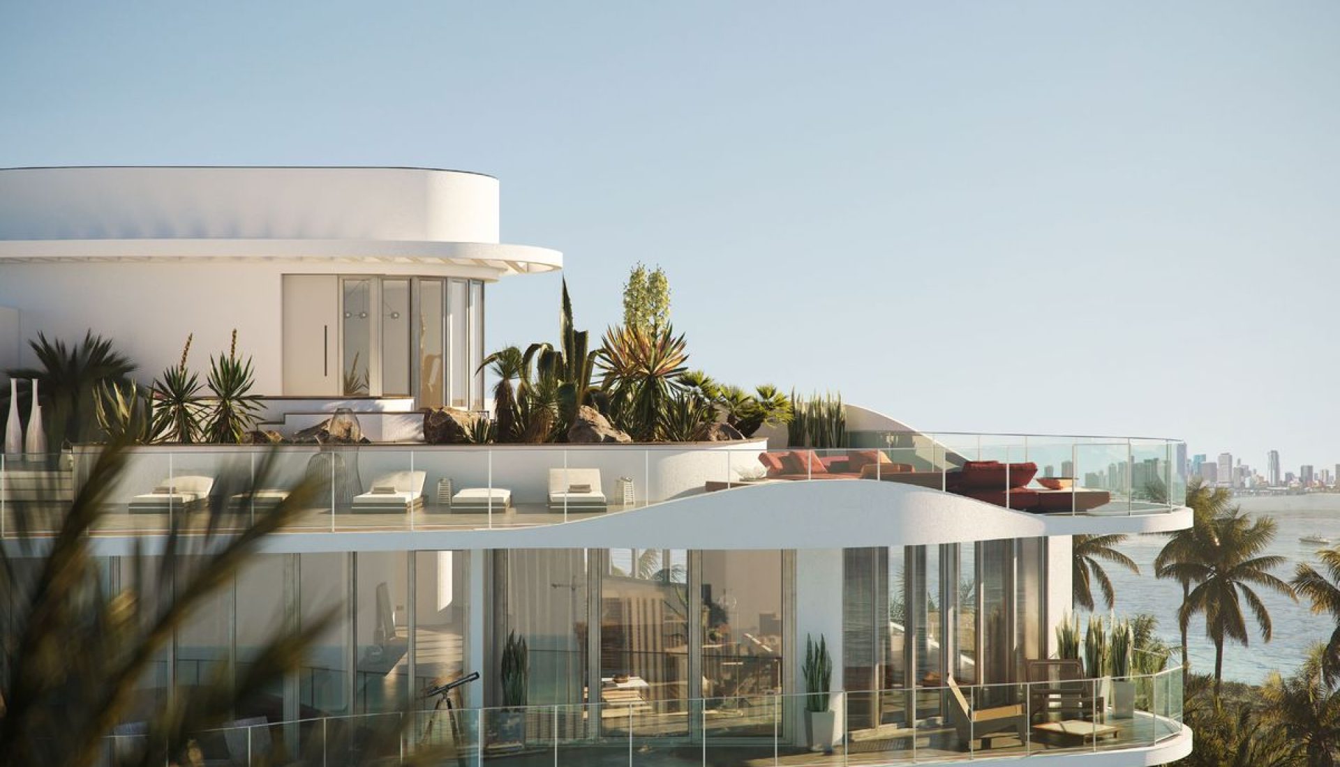 Modern glass-fronted luxury villa with a rooftop garden and ocean view.