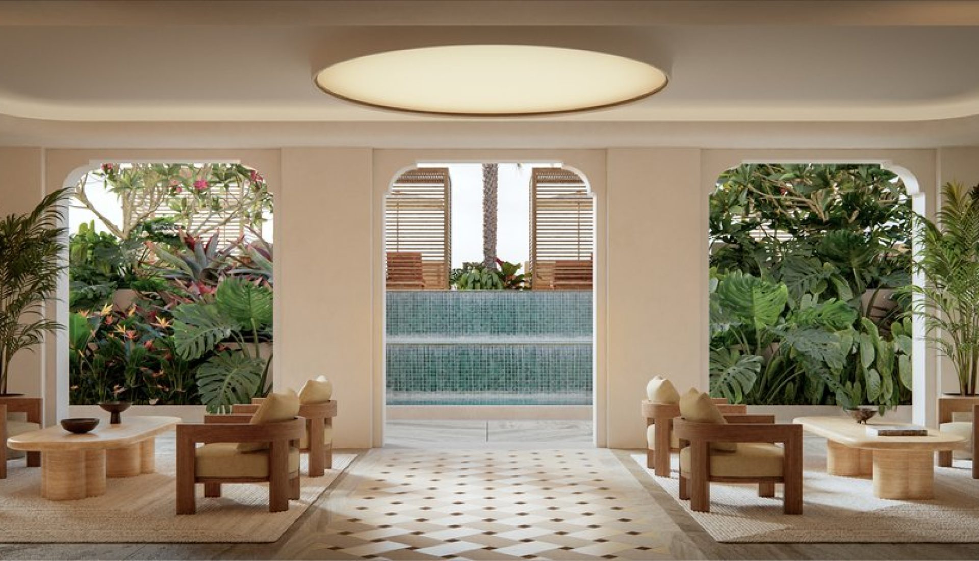 Symmetrical spa lounge with wooden chairs and low tables around beige rugs, tropical plants, and an outdoor water feature visible through arches