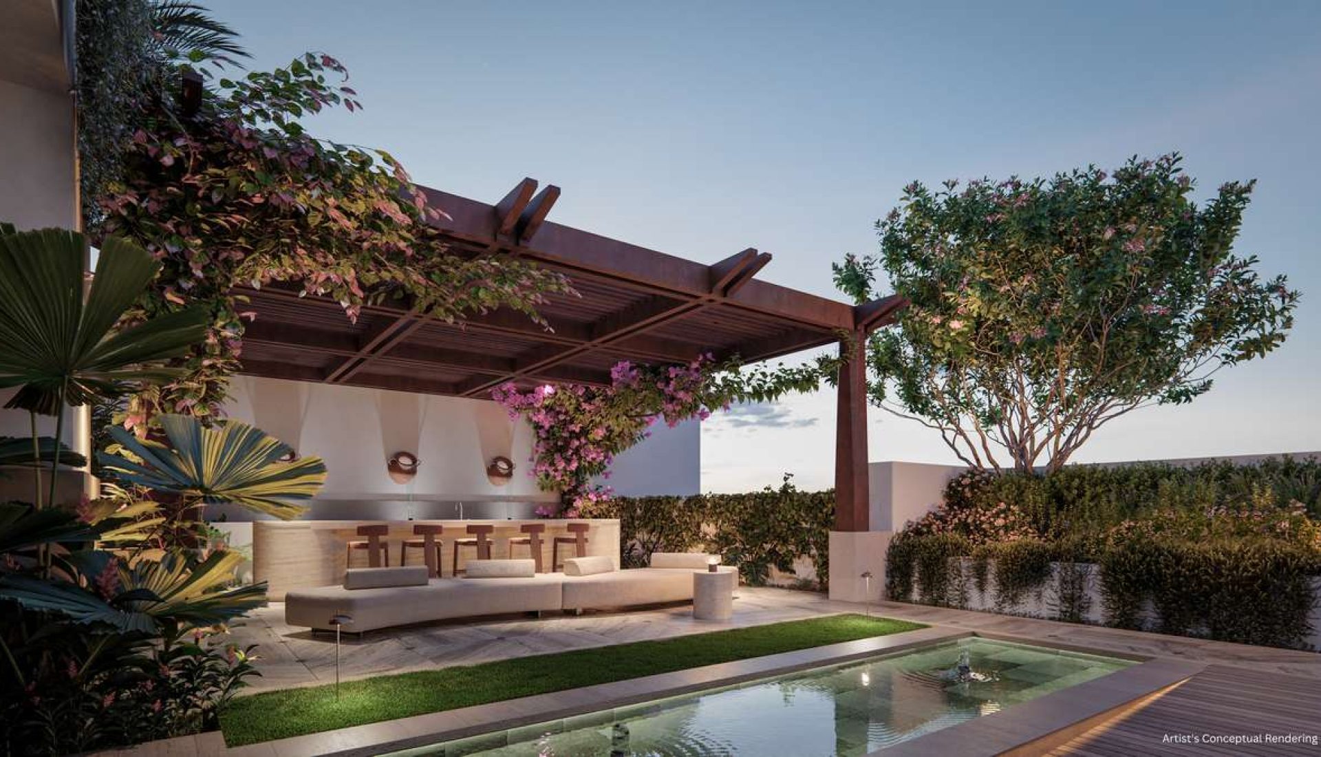 Outdoor lounge under a wooden pergola with a bar, cream sofa, and lush plants beside a rectangular pool.