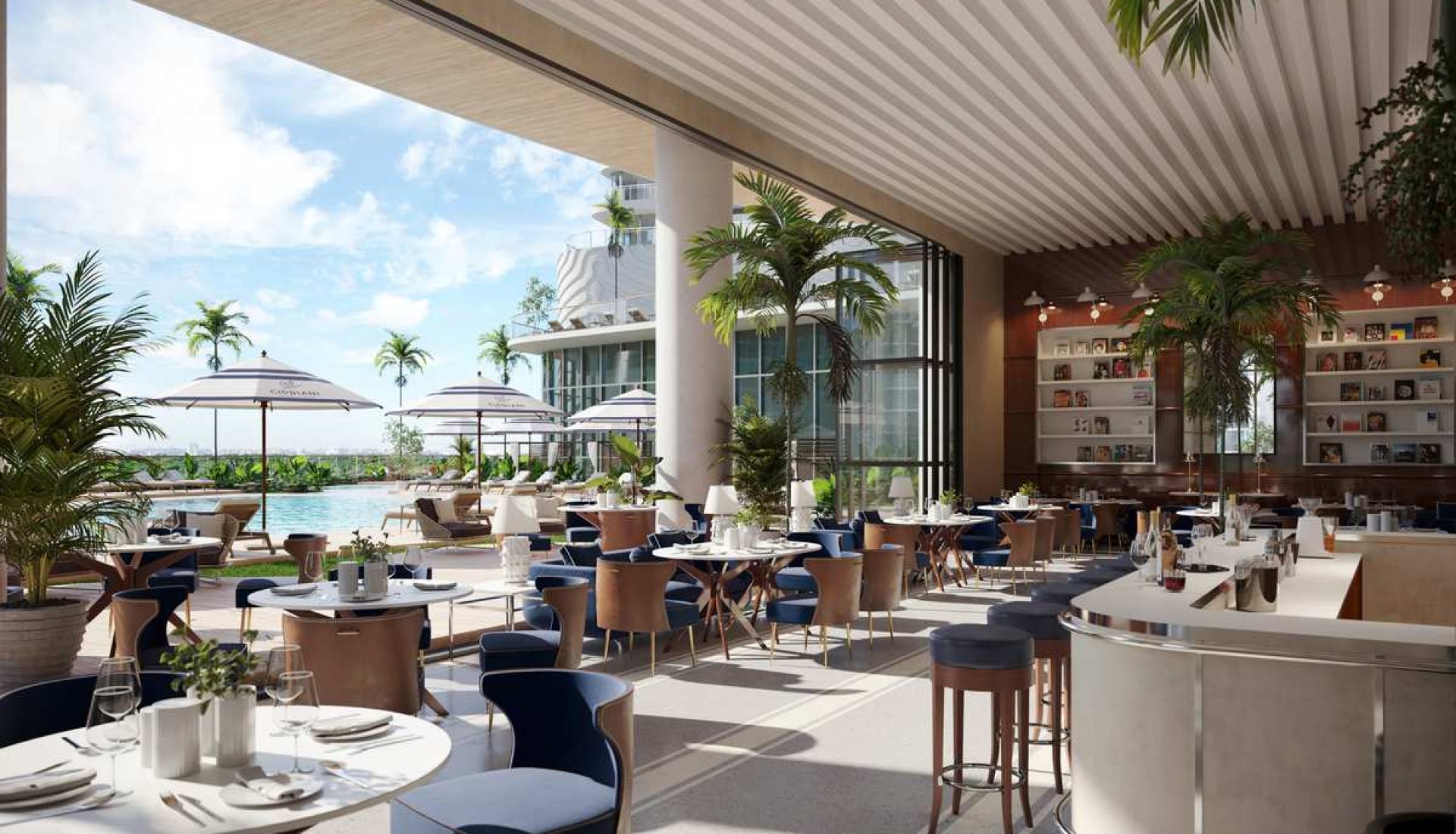 Open-air restaurant with white tables, blue chairs, and palm plants by a pool under a shaded ceiling and umbrellas in the background.