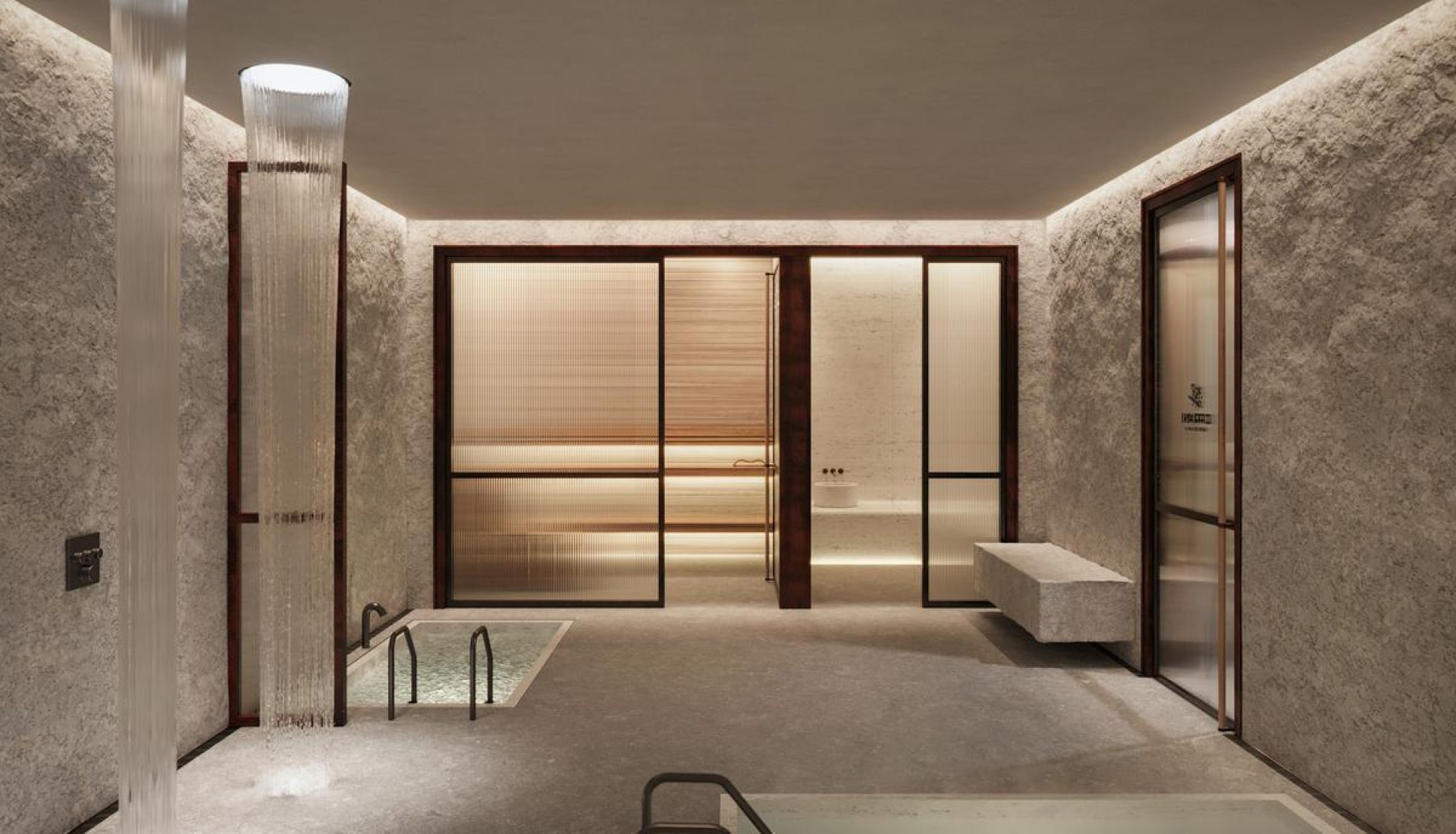 Luxurious indoor spa with frosted glass doors, a small soaking tub, stone walls, and warm ambient lighting.