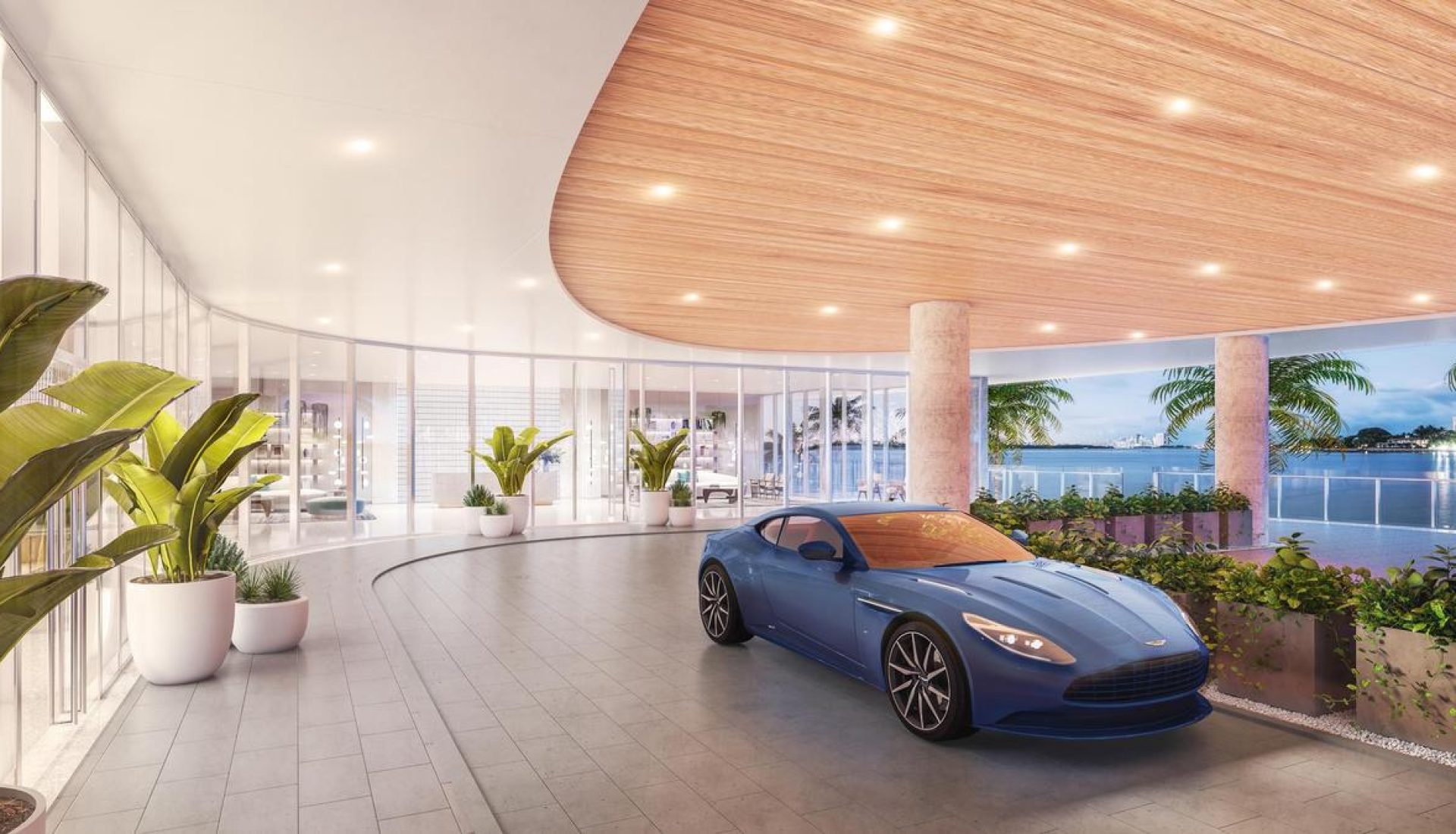 Blue sports car parked inside a modern glass-walled lobby with a curved wooden ceiling and potted plants by the windows.