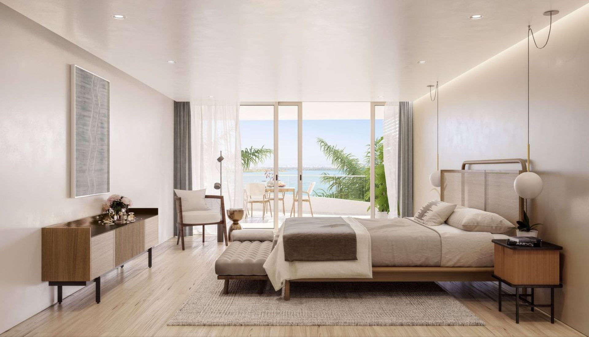 Bright modern hotel bedroom with a king bed, bench at the foot, and sliding doors to a balcony with a sea view.